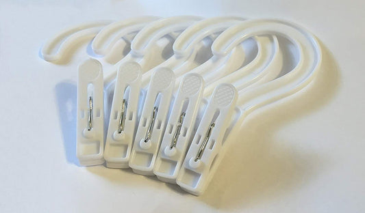 White laundry hanger hooks with strong plastic and solid metal spring, ideal for drying clothes.